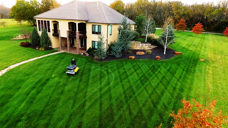 Lawn care customers turf treatment being applied at a residential home in the front yard